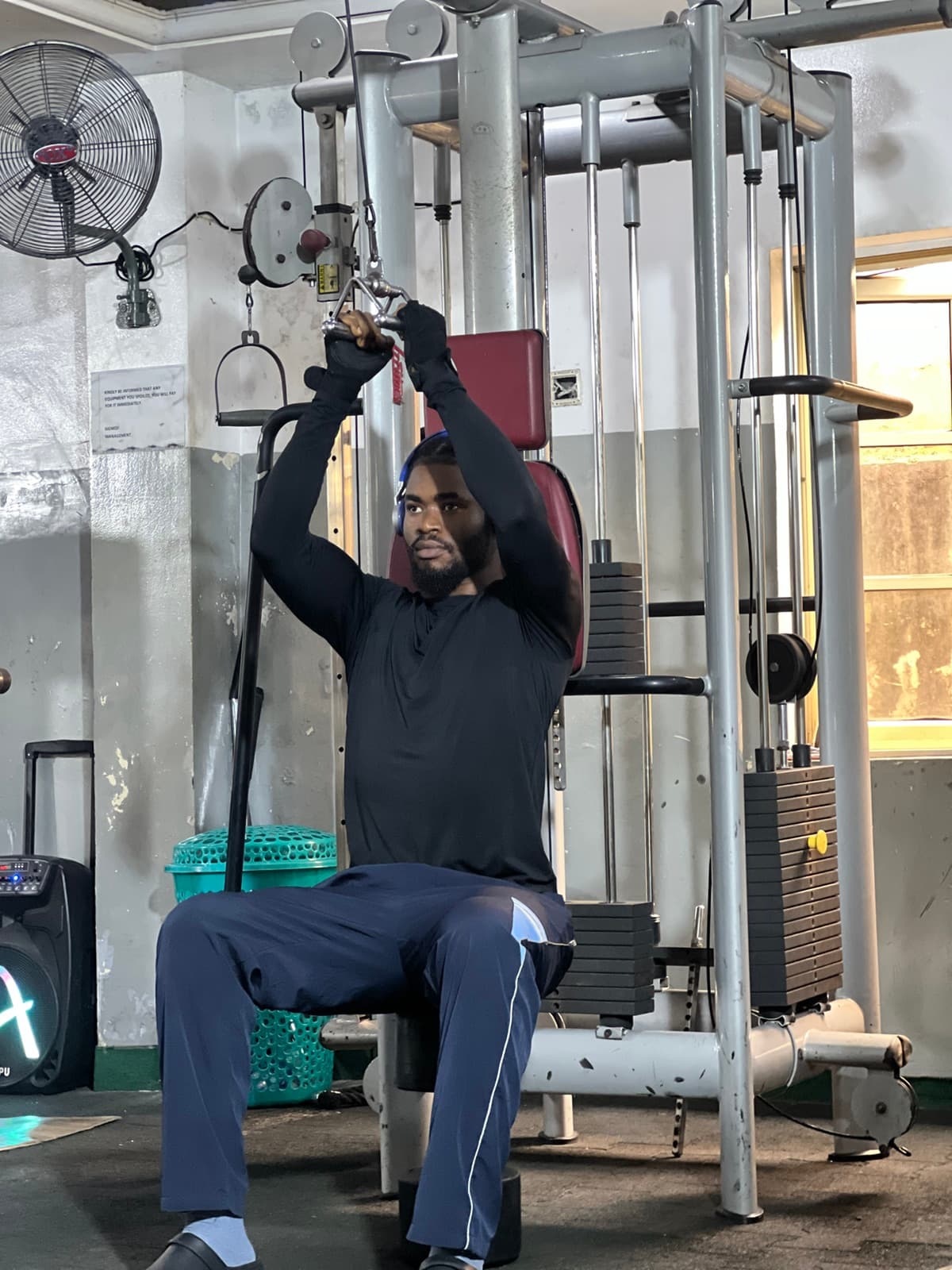 Member training on a cable machine at X-Fitness Gym